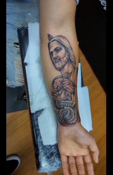 Money and San Judas Forearm Tattoo