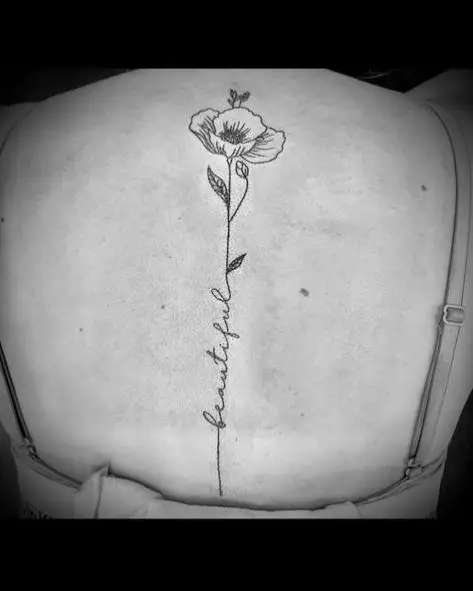 Flower with a Script Spine Tattoo