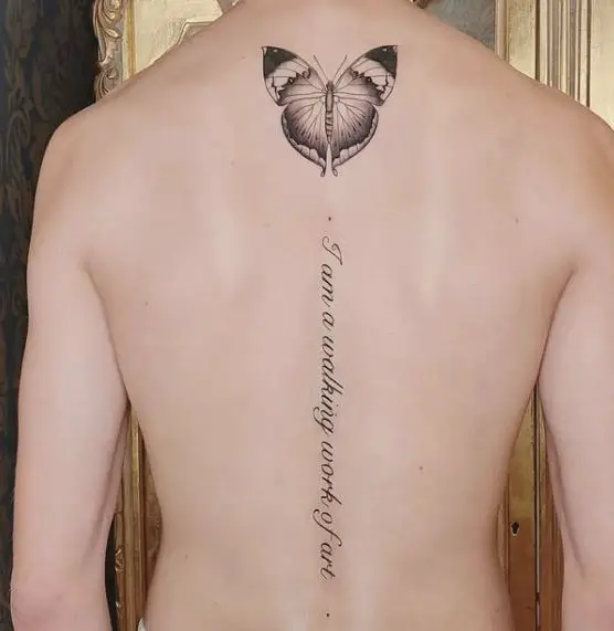 Butterfly and Text Spine Tattoo