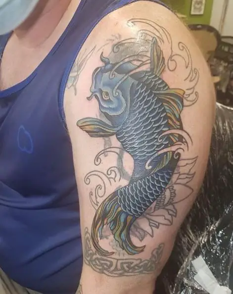 Swimming Blue Koi Fish Arm Tattoo