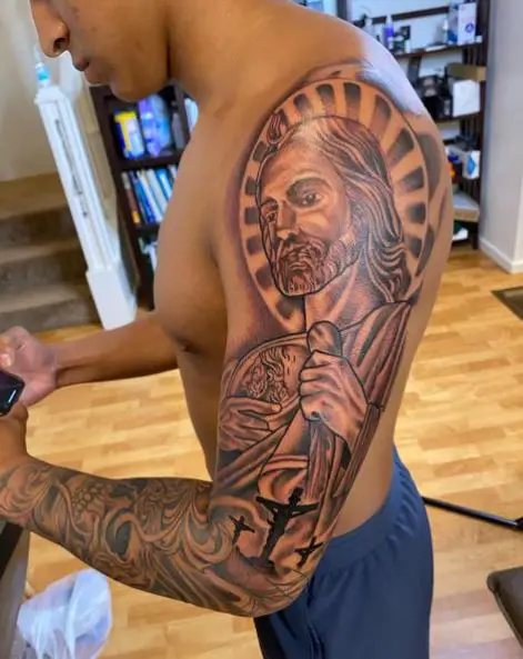 Crucifixion and San Judas Arm Sleeve Tattoo