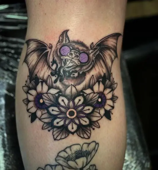 Flowers and Purple Eyed Bat Tattoo