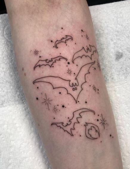 Linework Stars and Bats Arm Tattoo