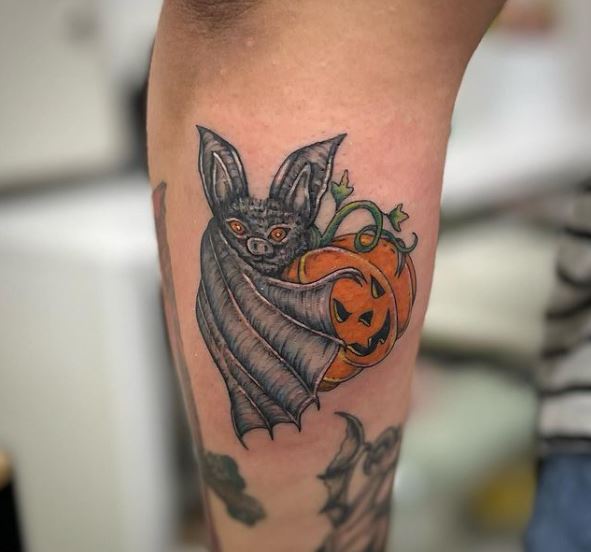 Bar Hugging Pumpkin Arm Tattoo