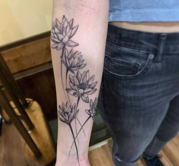 Grey and Black Traditional Water Lilies Forearm Tattoo