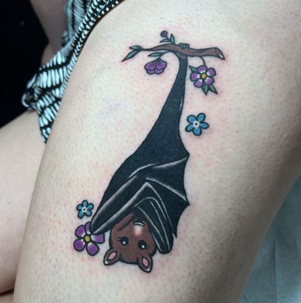 Flowers and Hanging Bat Leg Tattoo