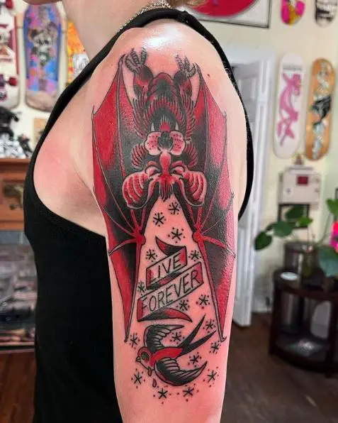 Bird and Red Bat Arm Tattoo