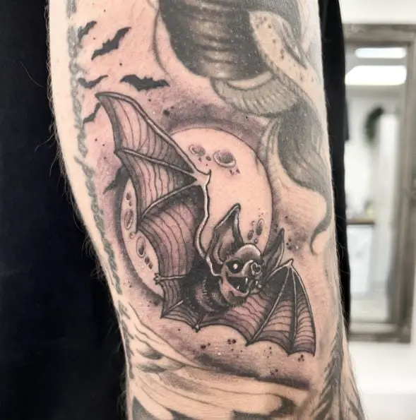Moon and Flying Bats Arm Tattoo