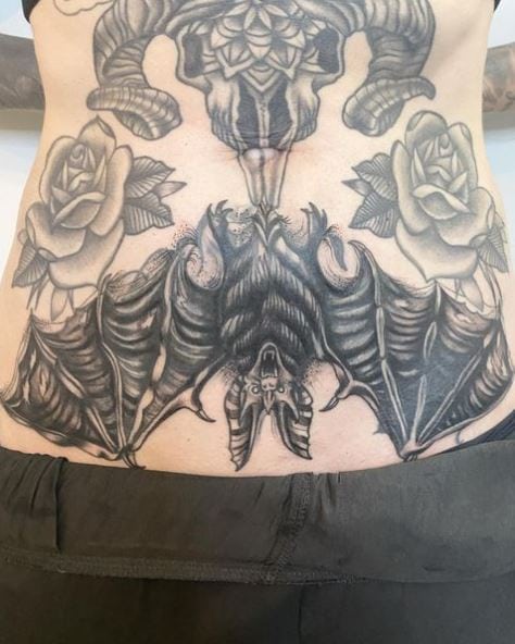 Roses and Hanging Bat Stomach Tattoo