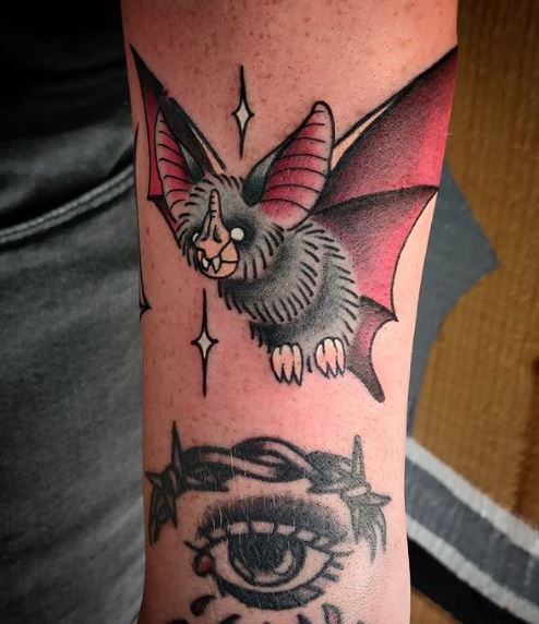 Crying Eye and Bat Arm Tattoo
