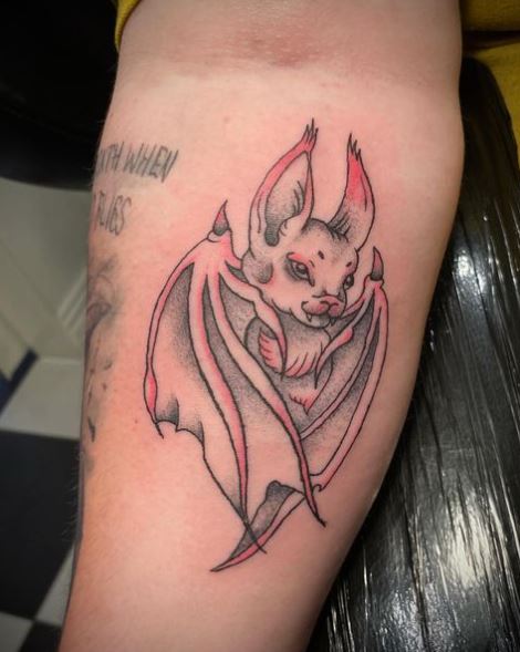 Happy Red Bat Arm Tattoo