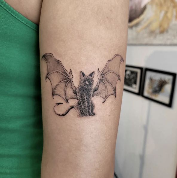 Cat with Bat Wings Arm Tattoo