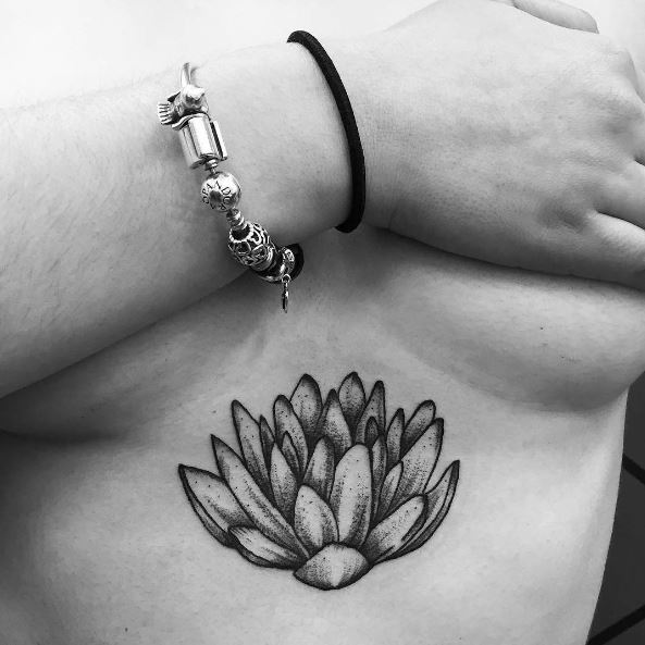 Black Water Lily Below Chest Tattoo