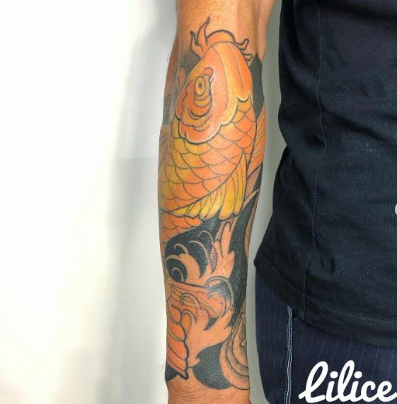 Golden Koi Fish Forearm Tattoo