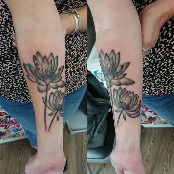 Black and Grey Traditional Water Lily Forearm Tattoo