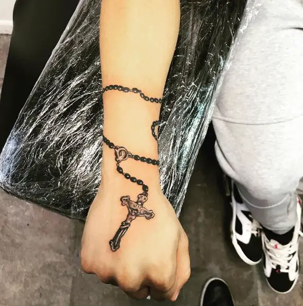 Realistic Rosary Tattoo on Wrist