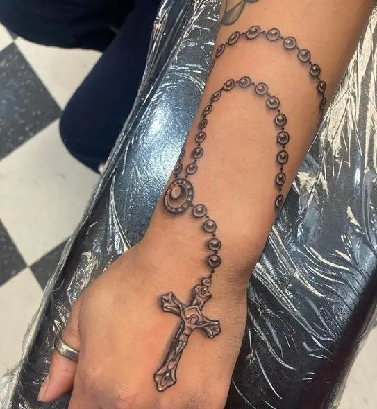 Forearm Rosary Tattoo with Cross