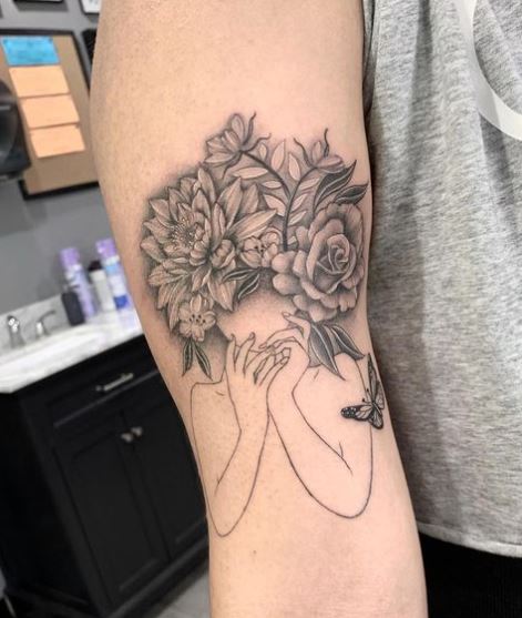 Butterfly with Rose and Water Lily Bouquet Arm Tattoo