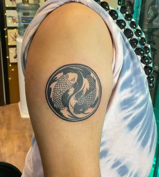 Yin Yang Koi Fishes Arm Tattoo