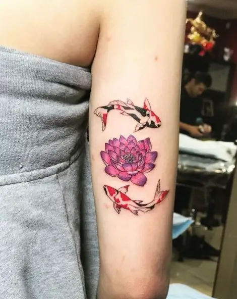 Lotus Flower and Koi Fishes Arm Tattoo
