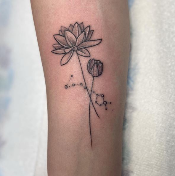 Stars Constellation and Water Lilies Arm Tattoo