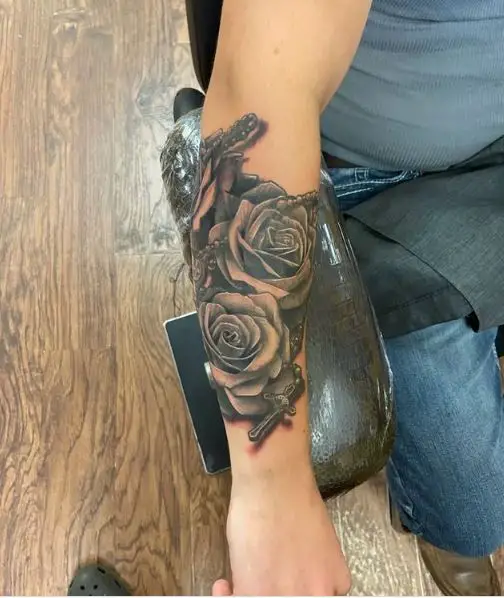 Roses and Rosary Tattoo on Forearm