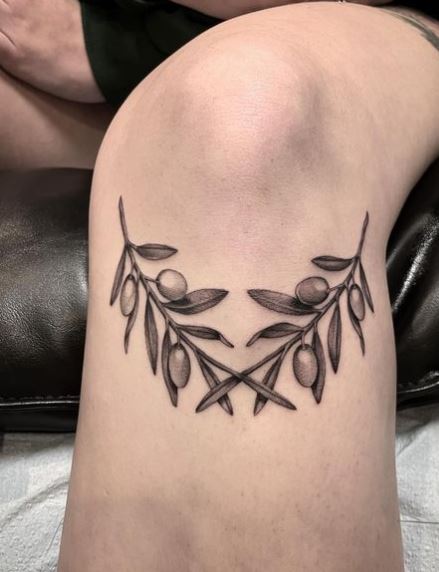 Crossed Olive Branches on Knee
