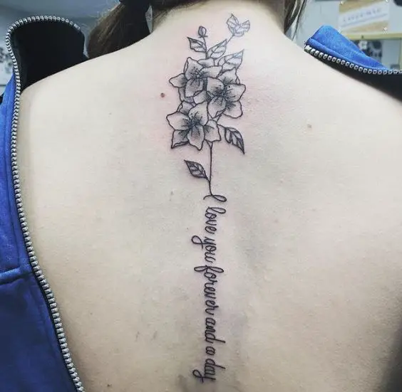 Birth Flowers with a Script Spine Tattoo