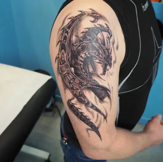Black Celtic Dragon Arm Tattoo