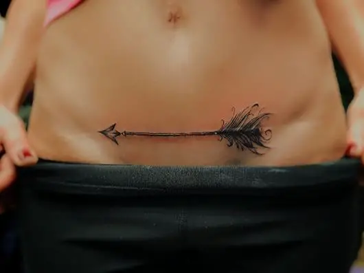 Black Feather Arrow Tattoo Below Tummy