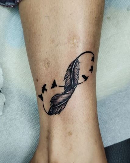 Black Infinity Bird Feather Tattoo