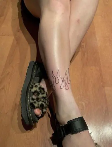 Black Ink Flames Tattoo On Legs