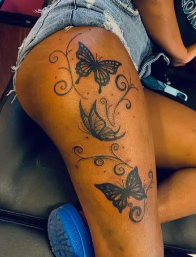 Black Butterfly Tattoo on the Thigh