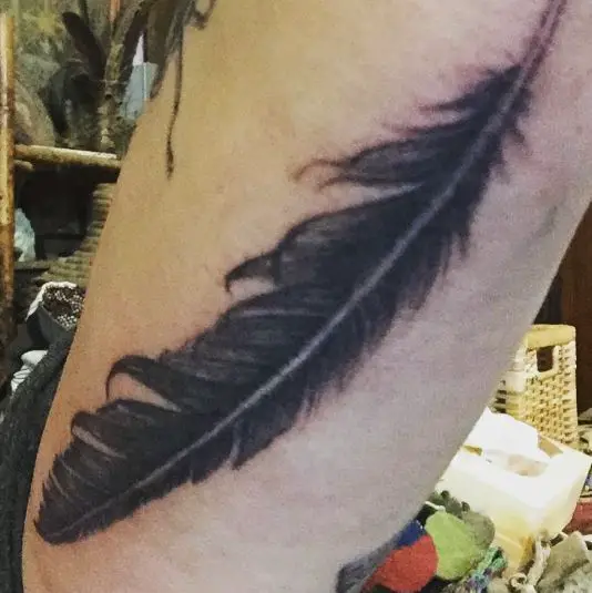 Black Inked Raven Feather Tattoo