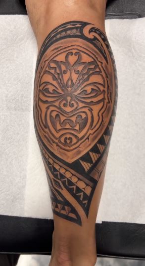Black Tribal Mask Tattoo