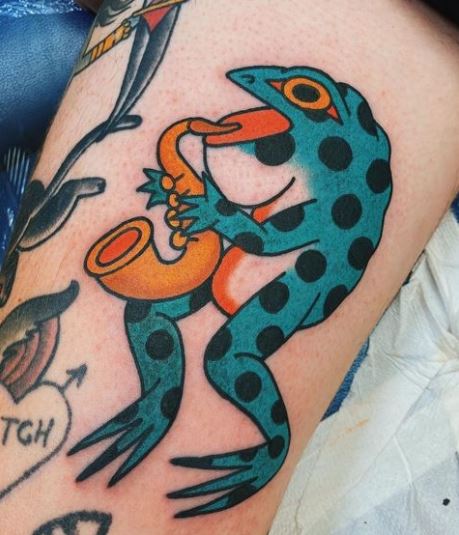 Blue Dotted Frog Tattoo with Trumpet
