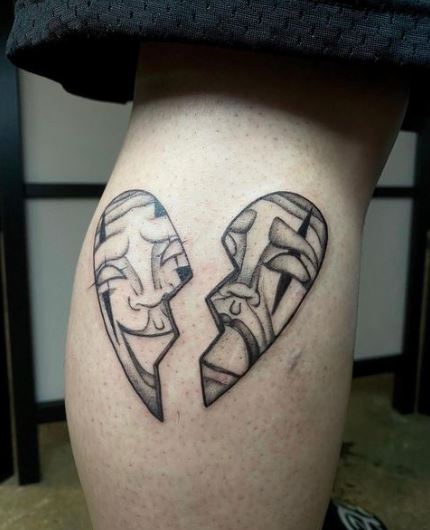 Laugh and Cry Broken Heart Tattoo on the Leg