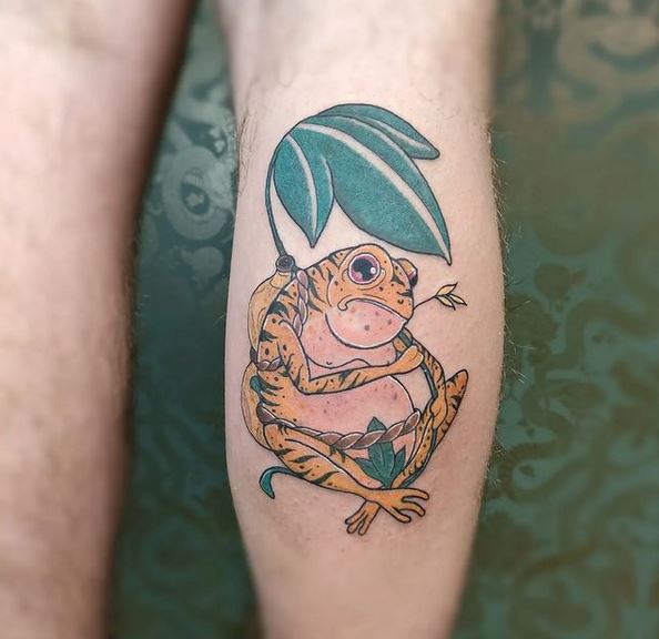 Brown Frog Tied With Plant Tattoo