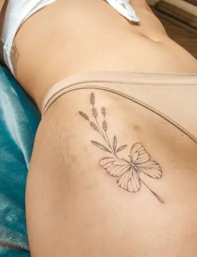 Butterfly and Plant Tattoo on the Thigh 