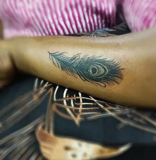 Crowded Peacock Feather Tattoo