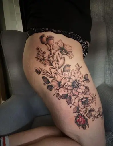 Flowers and Jewels Tattoo on the Thigh