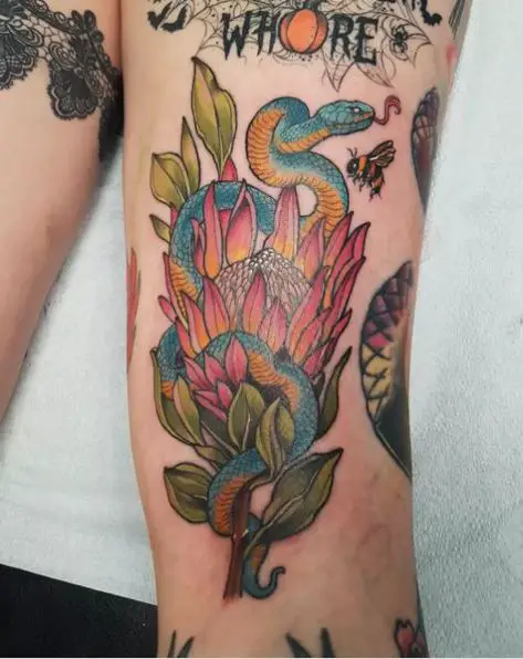 Blue and Yellow Snake on Flower Tattoo