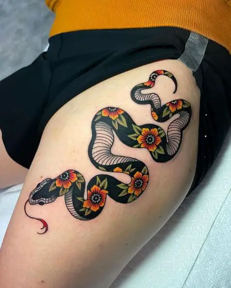 Snake Decorated With Flowers Tattoo