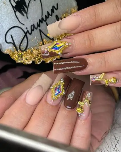 Gold Accessories On Brown Nails
