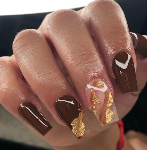 Gold Flakes On Brown Nails