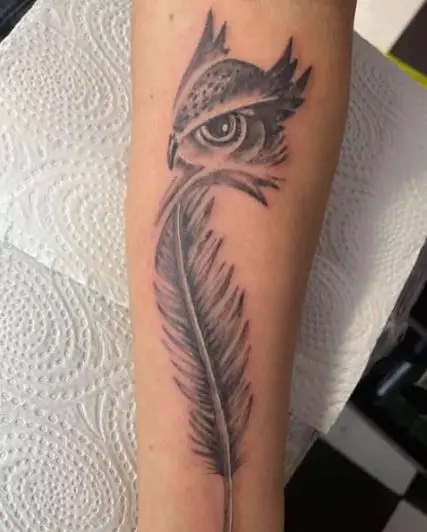 Grey Feather with Owl Eyes Tattoo