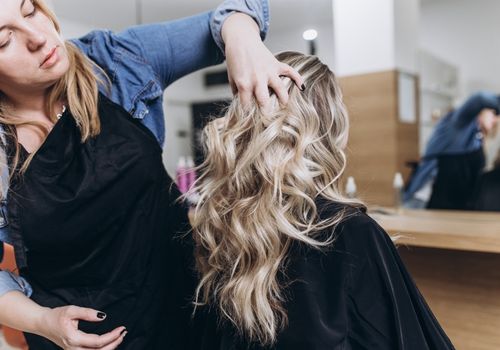 Hair Dresser Checking Hair Density