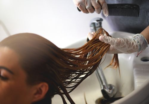 Hairdresser Prepping Customer's Hair