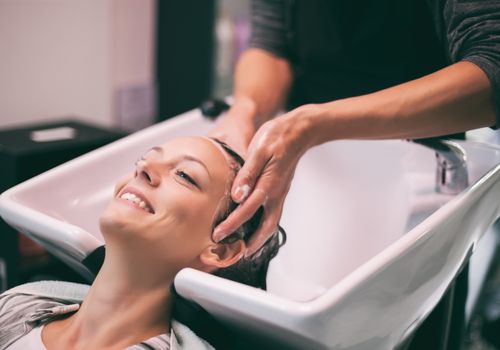 Hairdresser Washing Client's Hair