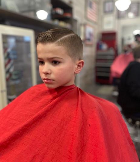 Half Shaved Side Combed Hair For a Young Boy